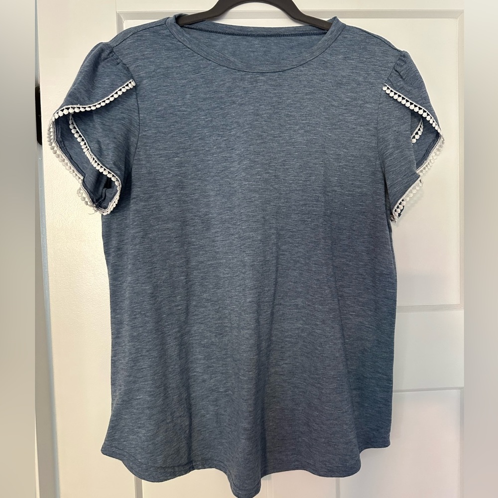 NWOT Boutique blue flutter sleeve top with sleeve details.